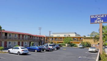 This image shows a motel with a sign reading 